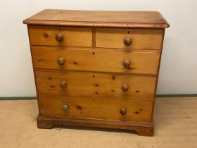 An early 20th century pine chest of drawers, with two short over three long drawers, height 98cm,