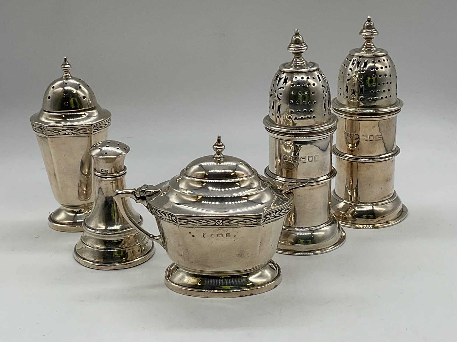 ELKINGTON & CO LTD; a pair of hallmarked silver cruets (marks obscured), height 11.5cm, a lidded