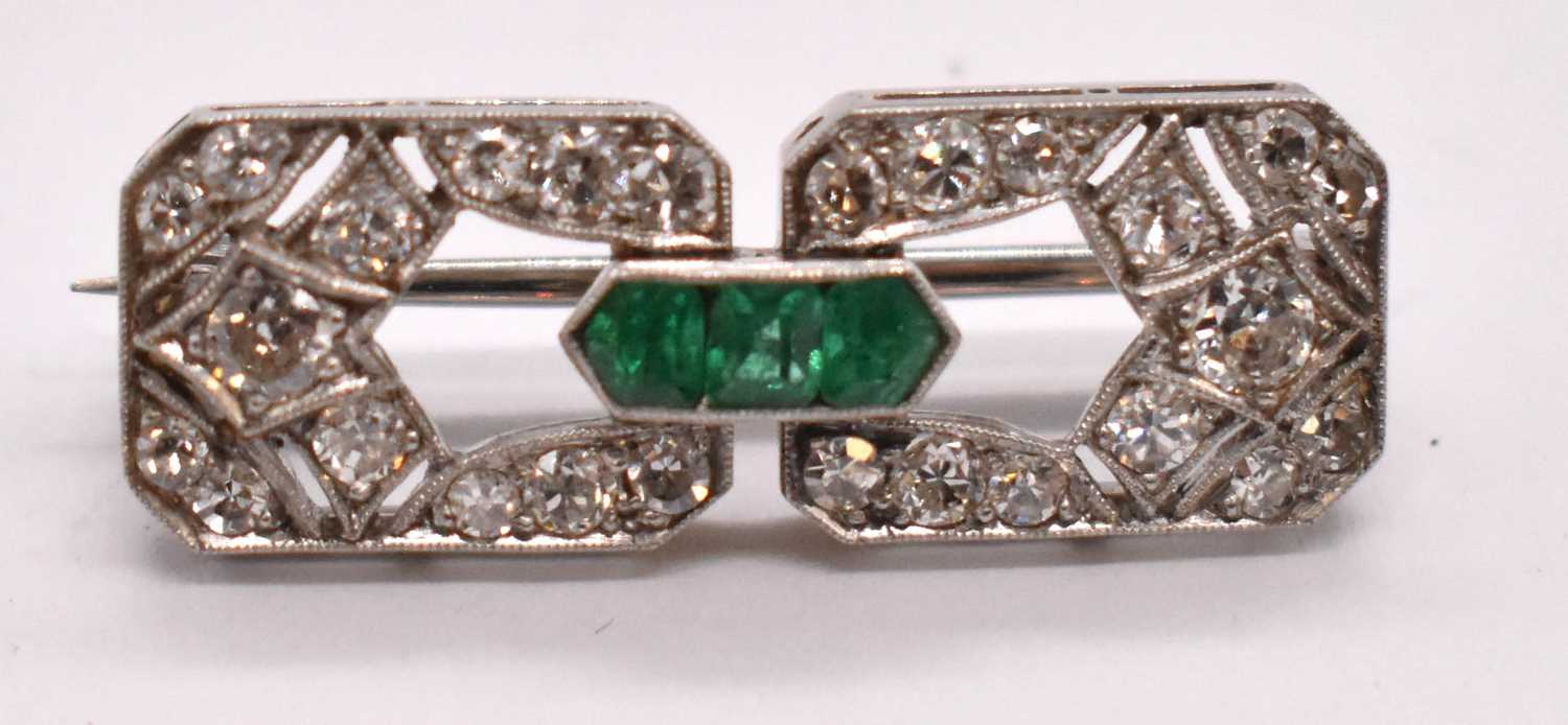 An Art Deco white metal emerald and diamond brooch set with three emeralds to the central raised - Image 3 of 6