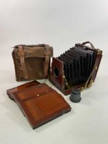 A late 19th century mahogany field camera, with McKellens double pinion casing and bellow focus,