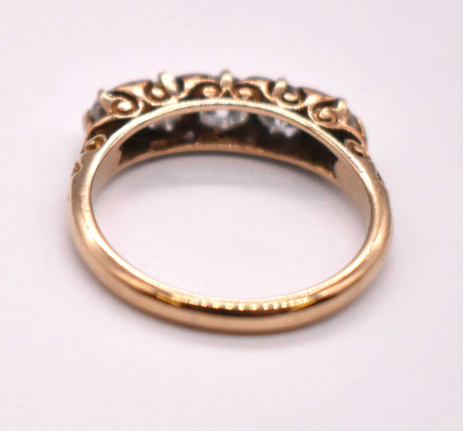 An 18ct yellow gold five stone diamond ring, the central stone weighing approx. 0.33cts, with - Image 3 of 3