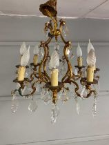 Two brass and cut glass ceiling lights, both with scroll branches and shaped drops, height 50cm (
