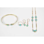 A suite of 14ct yellow gold and turquoise set jewellery, comprising necklace, bangle, ring, and pair