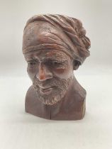 ALFREDA BERESFORD; a carved wooden bust, study of a gentleman wearing head adornment and with a