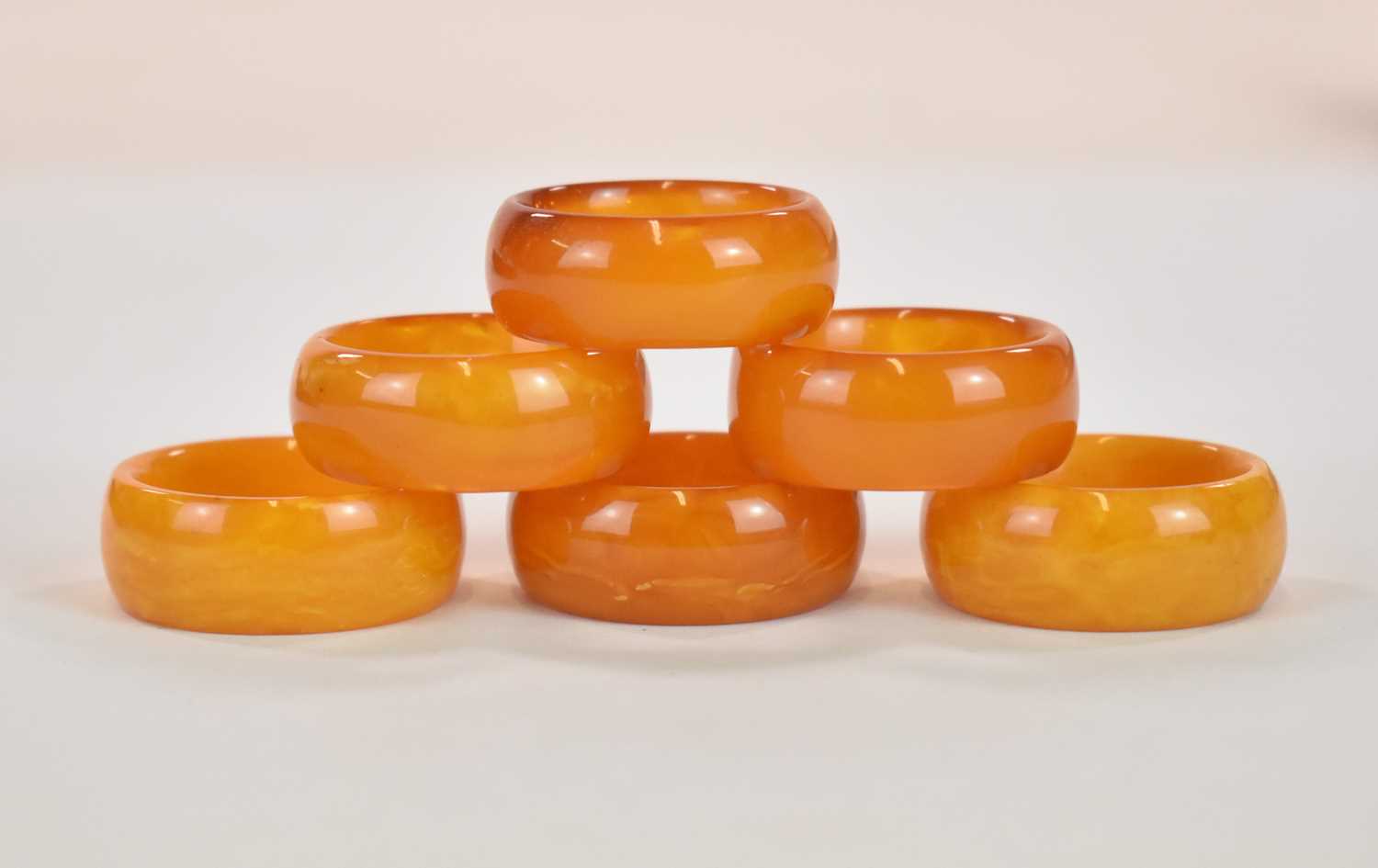 A rare set of six late 18th century 'Königsberg' egg yolk/butterscotch amber napkin rings, - Image 2 of 5