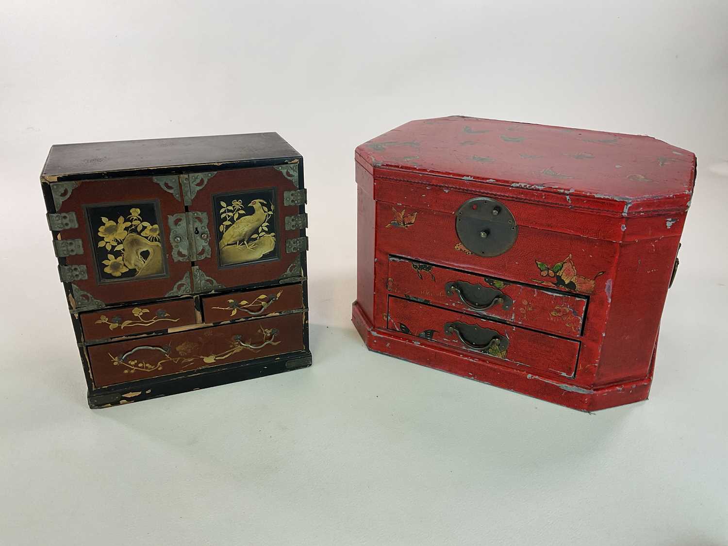 A Chinese lacquered table top cabinet with painted and gilt decoration of birds and flowers and