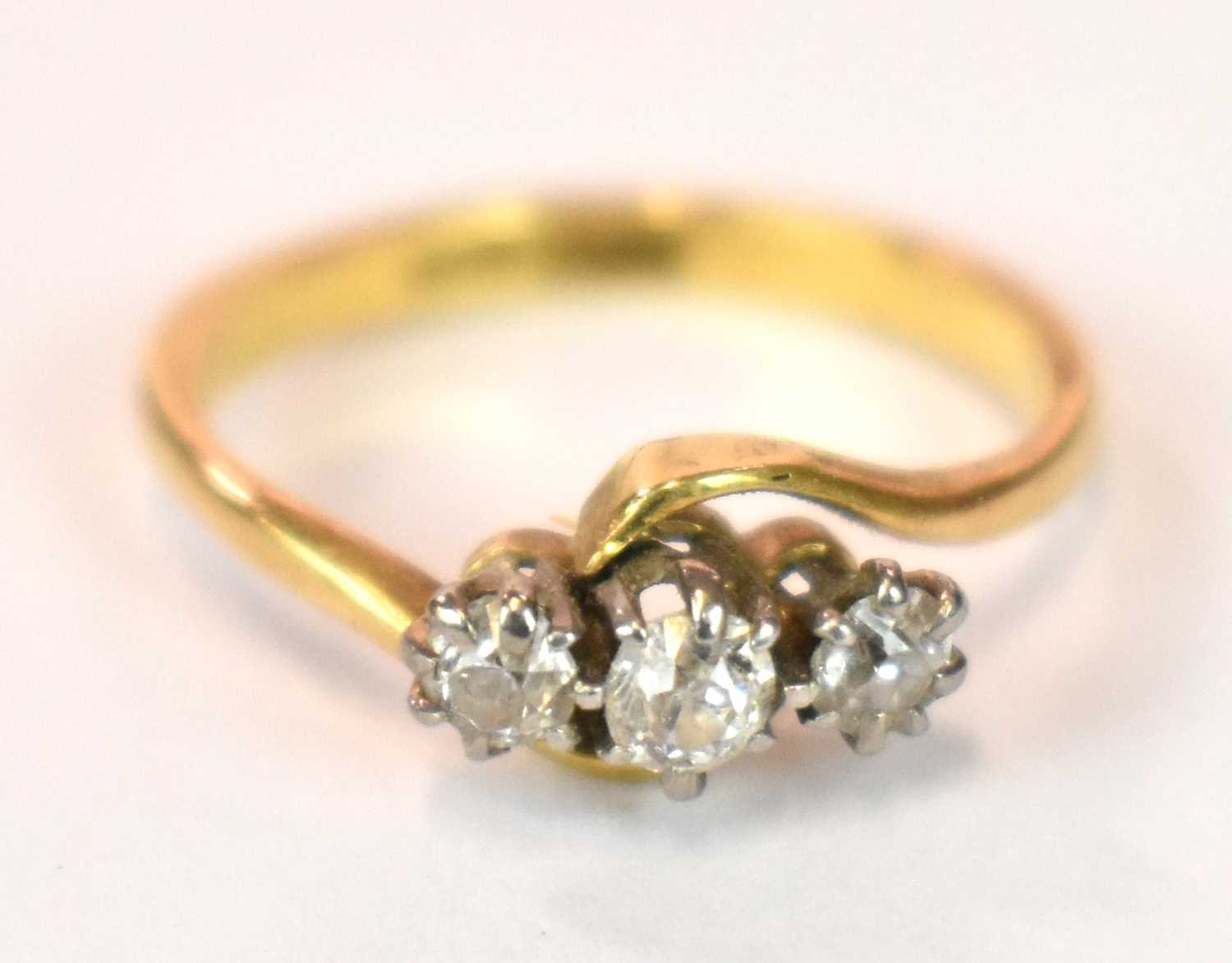 An 18ct yellow gold platinum tipped three stone diamond ring in swept setting, size J, approx. 3g. - Image 4 of 7