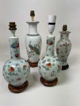 A pair of Chinese floral decorated lamp bases, height 29cm, and two further Chinese inspired