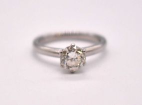 A platinum and diamond solitaire ring, the round brilliant cut six claw set stone weighing approx.