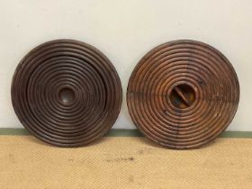 Two stained beech pre war pattern moulds for manhole covers, diameter of each 51cm.