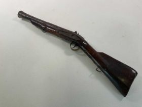 A 19th century blunderbuss with flintlock action, roller fisson and indistinct engraving to the lock