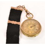 An 18ct yellow gold key wind open face fob watch with Roman numerals to the dial, and with base