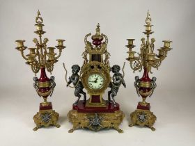 A large decorative Italian three piece clock garniture, clock height 62cm, garniture height 68cm.