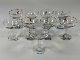 A group of nine vintage Babycham glasses.