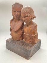 ALFREDA BERESFORD; a pair of carved wooden busts mounted on a single block, bearing artist's