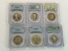 Six encapsulated coins, all with holograms and details from PCGS, comprising Canada 1953 50cents,