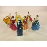 ROYAL DOULTON; a group of seven figures comprising 'Adrienne' HN2304, 'Julia' HN2705, 'Kirsty'