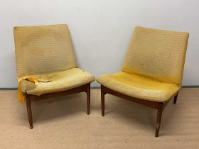 A pair of mid 20th century teak framed upholstered lounge chairs, height 75cm at the back, width