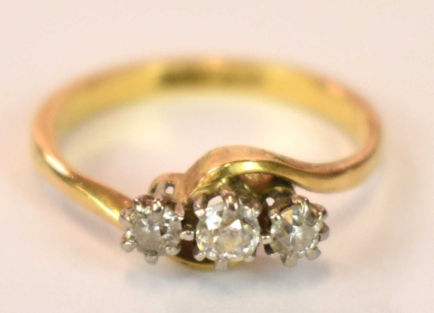 An 18ct yellow gold platinum tipped three stone diamond ring in swept setting, size J, approx. 3g. - Image 3 of 7