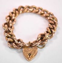 A 9ct gold curb link bracelet with heart shaped padlock clasp, approx. 21.55g.