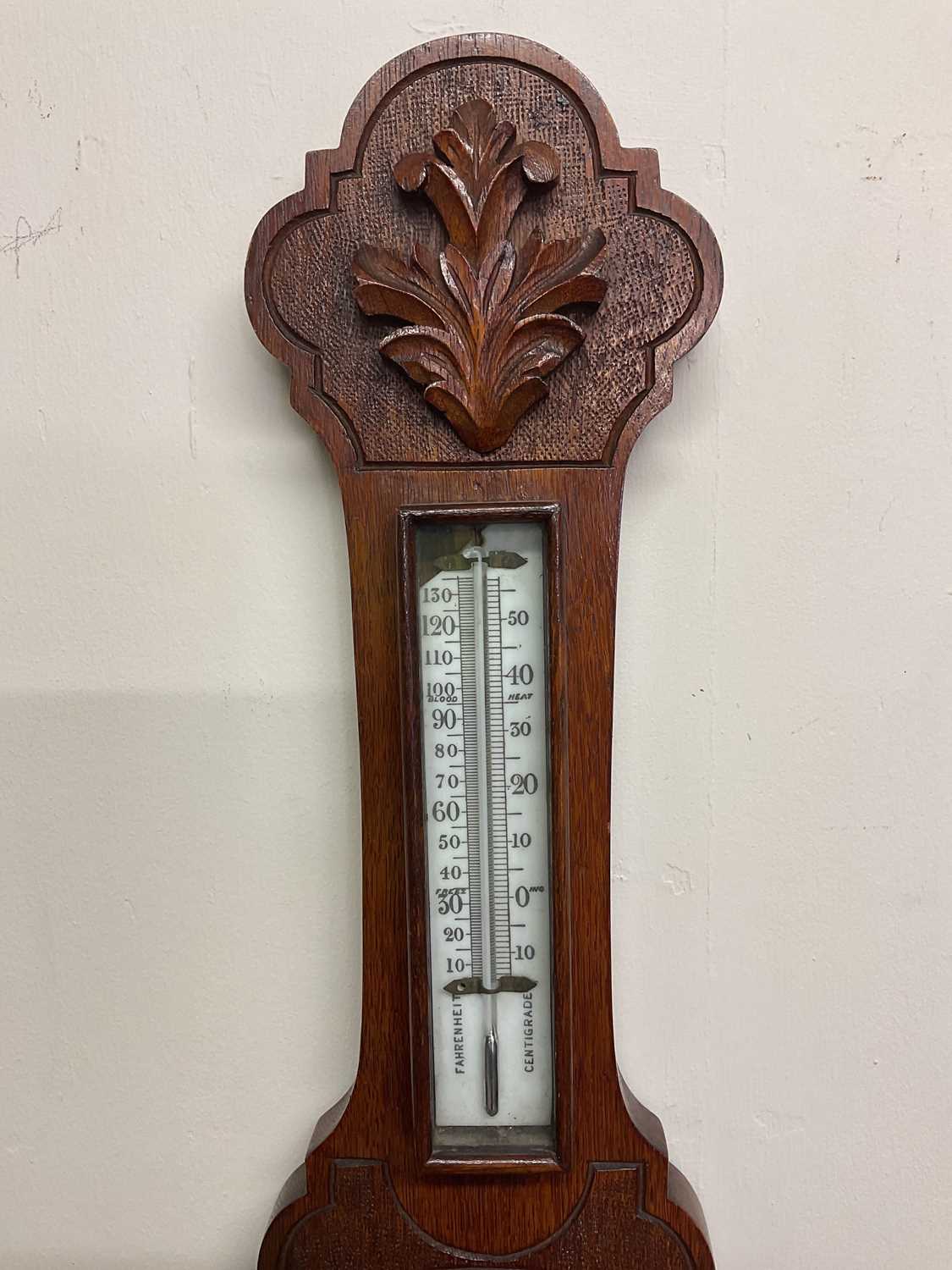 A carved oak barometer with porcelain dial and scale, length 71cm. - Image 3 of 3