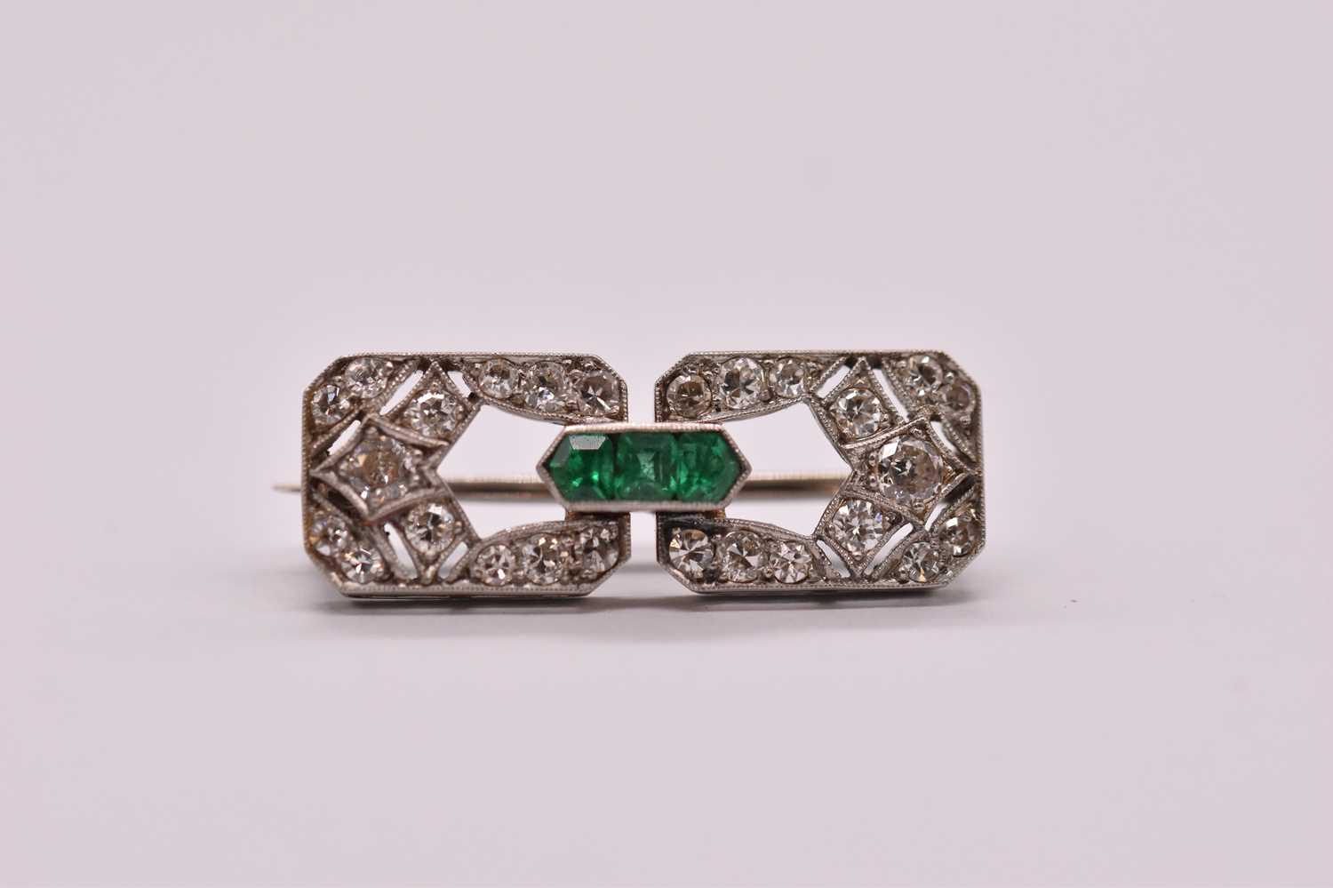 An Art Deco white metal emerald and diamond brooch set with three emeralds to the central raised - Image 6 of 6