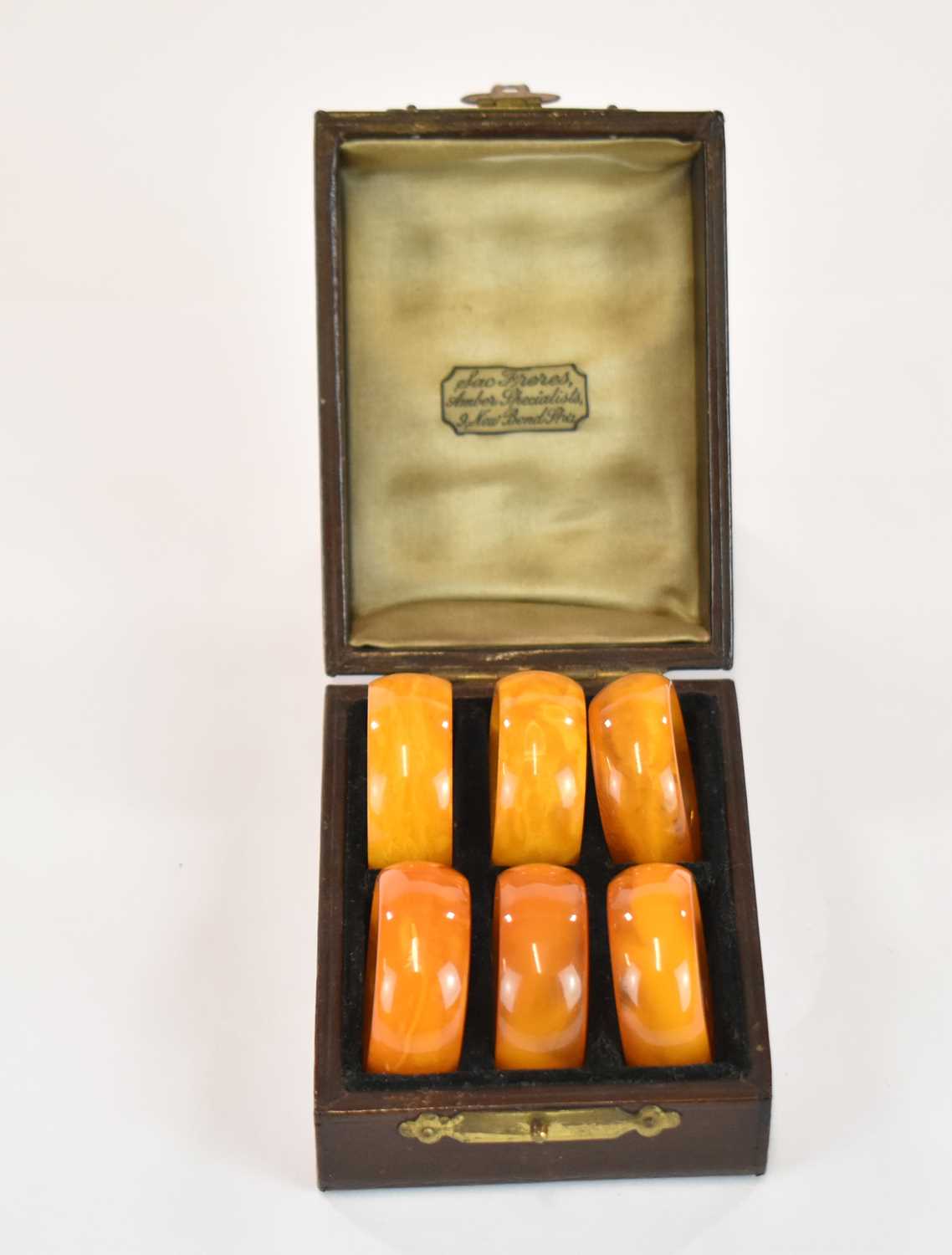 A rare set of six late 18th century 'Königsberg' egg yolk/butterscotch amber napkin rings,