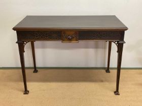An Edwardian Adam Revival fretwork decorated mahogany single drawer side table, raised on square