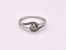 A 9ct white gold diamond set ring of swept design, size R 1/2, approx. 2g.