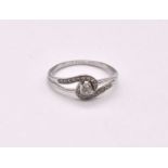 A 9ct white gold diamond set ring of swept design, size R 1/2, approx. 2g.