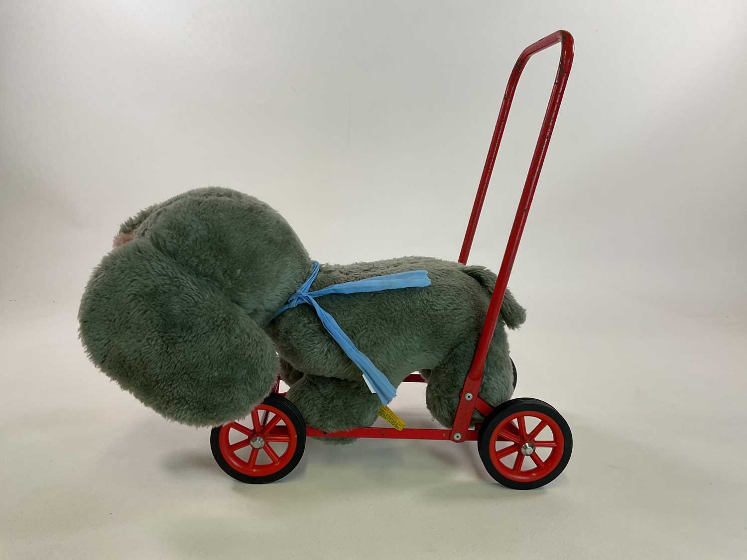 DEANS; a vintage push along plush elephant, height 52cm Condition Report: Age related wear