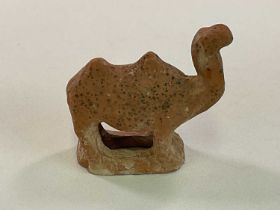 A Chinese Tang dynasty (618-906AD) votive hollow moulded pottery figure of a camel standing on an