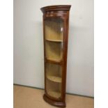 A reproduction tall bowfronted corner cupboard, height 200cm, depth 35cm.