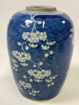 A large 19th century Chinese blue and white jar painted with peonies, painted double ring mark to