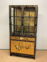 A contemporary Chinese lacquered display cabinet with glazed upper section, width 95cm.