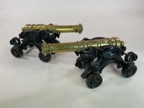 A large pair of Victorian table cannon, each with turned gunmetal barrels and on elaborate