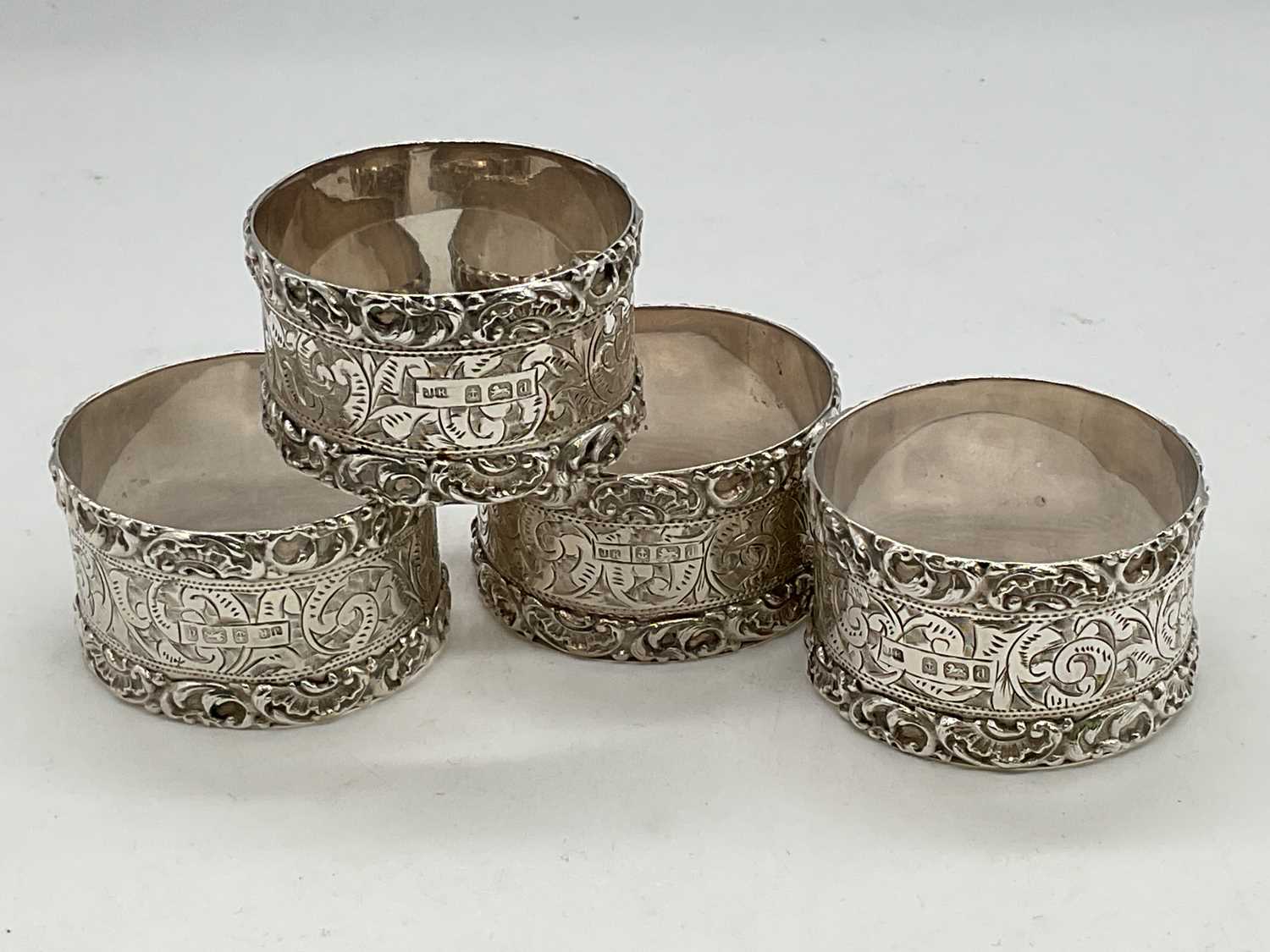 A set of four Edwardian hallmarked silver napkin rings with engraved central band and numbered 1 - - Image 5 of 5