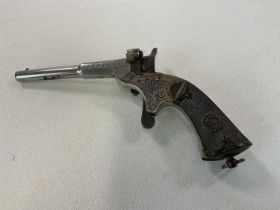 A late 19th/early 20th century pocket pistol with bakelite stock, length 17cm. Condition Report: The