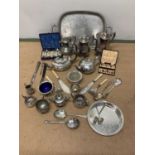 A quantity of silver plate including a boxed set of tea spoons, tray and other items, and a silver