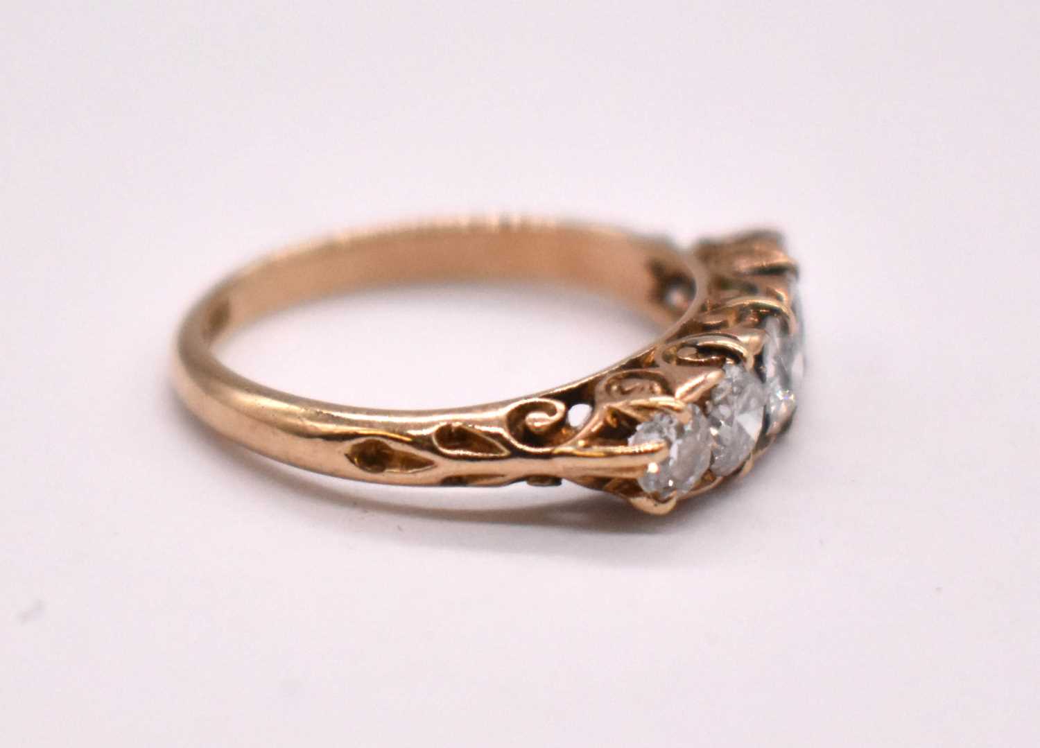 An 18ct yellow gold five stone diamond ring, the central stone weighing approx. 0.33cts, with - Image 2 of 3