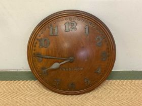 ENGSTROM OF SWEDEN; an early 20th century wall clock, constructed of solid oak of convex form,