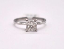 A platinum and diamond solitaire ring, the princess cut stone weighing approx. 1.01cts, assessed