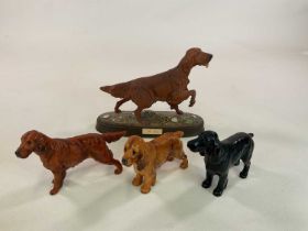 ROYAL DOULTON AND BESWICK; a dog figures includes a setter, height 23cm, and black spaniel, and