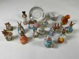 A collection of Beswick Beatrix Potter figures including 'Flopsy, Mopsy and Cotton Tail', 'Peter