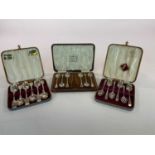 DOCKER & BURN; a cased set of six silver teaspoons with sugar tongs, Birmingham, 1928, and two