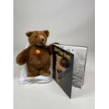 STEIFF; an Urs bear together with a 'Steiff - Teddy Bears Love for a Lifetime' book.