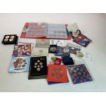 A quantity of coins, including several commemorative packs, also a 1999 Guernsey £5 gold coin (1/