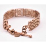 A 9ct rose gold panel link bracelet with T-bar and sprung clasp, length 20cm, approx. 31.32g.