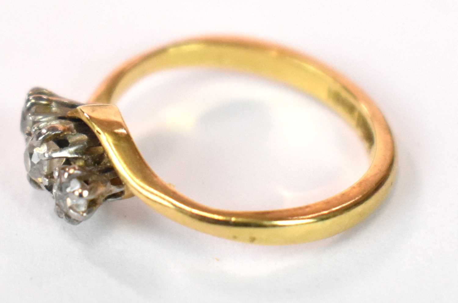 An 18ct yellow gold platinum tipped three stone diamond ring in swept setting, size J, approx. 3g. - Image 6 of 7