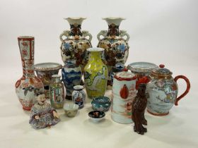 A quantity of Chinese and Japanese ceramics, comprising vases, figures, teapots etc, height of